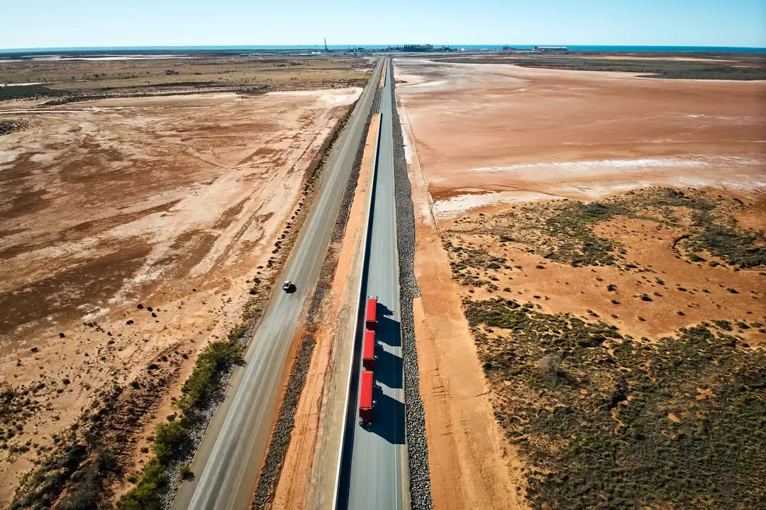 Auto road train travels on sealed, fenced haul road from Ken’s Bore to Port of Ashburton.